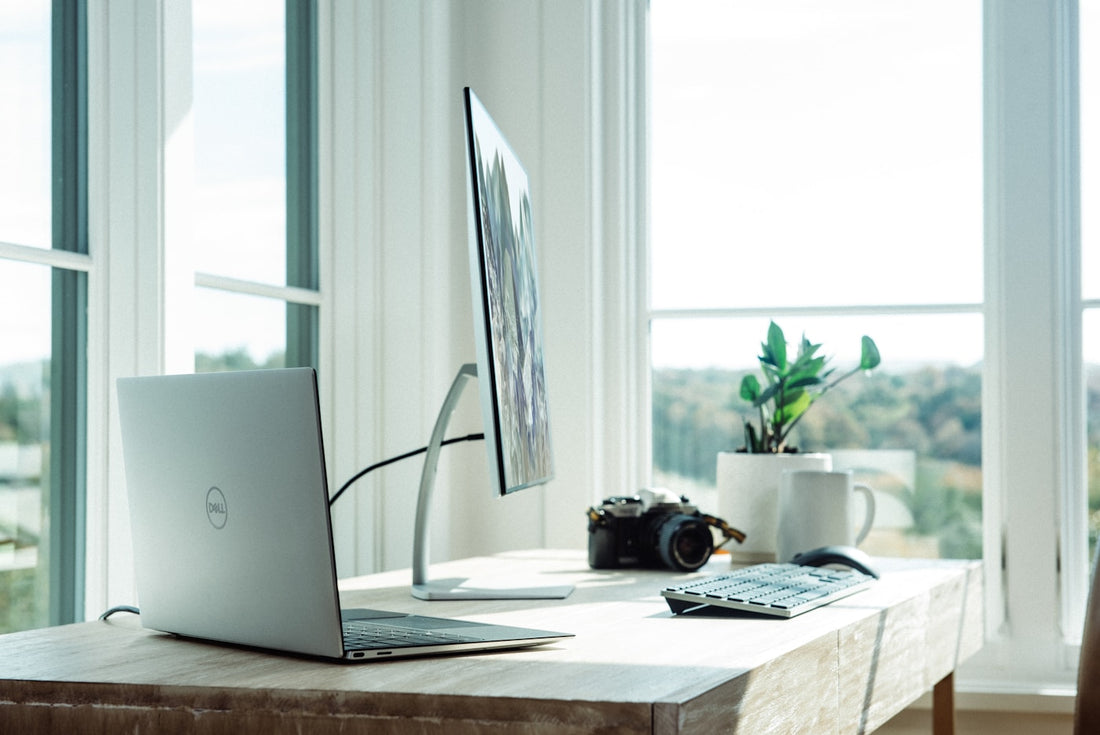 Minimal home office desk setup with monitor and accessories