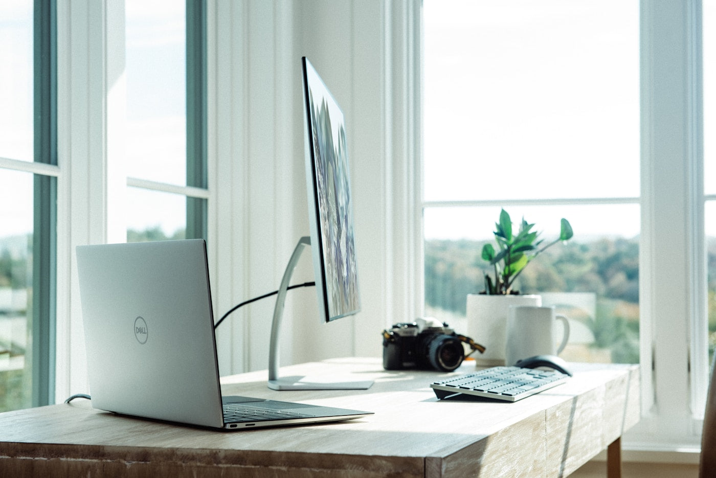Minimal home office desk setup with monitor and accessories